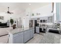 Open-concept kitchen with stainless steel appliances and eat-in island at 30645 N 44Th St, Cave Creek, AZ 85331