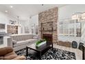 Comfortable living room featuring a stone fireplace and neutral decor at 30645 N 44Th St, Cave Creek, AZ 85331