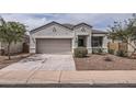 Attractive single-Gathering home with a desert-style front yard and attached garage at 30996 W Osborn Rd, Buckeye, AZ 85396