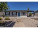 Inviting single-story home with desert landscaping and covered parking at 3208 N El Dorado Dr, Chandler, AZ 85224