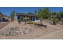 Single-story home with xeriscaping featuring decorative rocks and mature landscaping at 3208 N El Dorado Dr, Chandler, AZ 85224