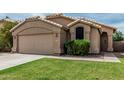 Close-up of a single-story house exterior showcasing architectural details and landscaping at 3856 E Encinas Ave, Gilbert, AZ 85234