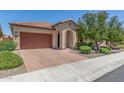 Beautiful single-story home with a paver driveway, two-car garage, and attractive landscaping at 3886 E Ficus Way, Gilbert, AZ 85298