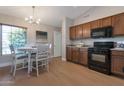Cozy dining area with natural light and modern chandelier at 3925 N 160Th Ave, Goodyear, AZ 85395