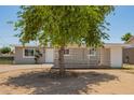 Charming single-story home featuring a well-maintained front yard and a welcoming entrance at 5029 W Osborn Rd, Phoenix, AZ 85031