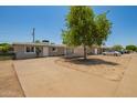 Charming single-story home featuring a well-maintained front yard and a welcoming entrance at 5029 W Osborn Rd, Phoenix, AZ 85031