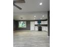 Bright kitchen featuring white cabinets, stainless appliances, and modern hanging lights at 5029 W Osborn Rd, Phoenix, AZ 85031