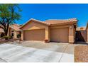 Three-car garage home with a tile roof and desert landscaping at 5912 W Gail Dr, Chandler, AZ 85226