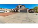 Charming two-story home with a well-manicured front yard, and a two car garage at 7749 W Hearn Rd, Peoria, AZ 85381