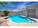 Inviting backyard pool with surrounding patio, perfect for relaxing and entertaining at 866 W Geronimo St, Chandler, AZ 85225