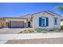 Inviting single-Gathering home with a two-car garage, desert landscaping, and classic shutters at 10715 E Thornton Ave, Mesa, AZ 85212