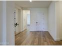 Bright entryway features hardwood floors, neutral walls, and an open floor plan with modern finishes at 10715 E Thornton Ave, Mesa, AZ 85212