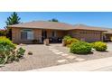 Charming single story home features desert landscaping and a quaint front patio at 11523 E Lindner Ave, Mesa, AZ 85209