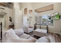 Comfortable living room featuring high ceilings, large windows, and plenty of natural light at 1254 W Browning Way, Chandler, AZ 85286