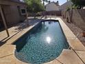 Sparkling swimming pool with surrounding patio, perfect for relaxation and entertaining in a private backyard setting at 1309 W Calle Del Norte --, Chandler, AZ 85224