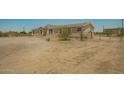 View of the property, showcasing the house with surrounding landscape and fenced in yard at 13217 S Tuthill Rd, Buckeye, AZ 85326