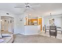 Inviting living space with an open floor plan, connecting the living room, dining area, and kitchen at 16631 E El Lago Blvd # 208, Fountain Hills, AZ 85268
