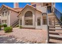Attractive condo exterior with large windows, terra cotta roof, and low maintenance landscaping at 19820 N 13Th Ave # 175, Phoenix, AZ 85027