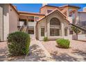 Beautiful condo building with lovely desert landscaping, private entrances, and tile roof at 19820 N 13Th Ave # 175, Phoenix, AZ 85027