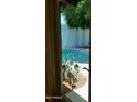 Backyard swimming pool with cacti and desert landscaping at 2068 E Cairo Dr, Tempe, AZ 85282