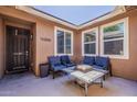 Outdoor patio with slate tile table, comfortable seating, and a cozy fire pit feature at 3173 N Clanton St, Buckeye, AZ 85396