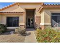 Welcoming front entrance featuring a covered porch and landscaped walkway at 4338 E Hamblin Dr, Phoenix, AZ 85050