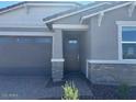 Charming single Gathering home with an attached two car garage and low maintenance landscaping at 5573 S 246Th Ave, Buckeye, AZ 85326