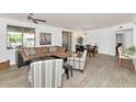 Bright living room featuring a comfortable sectional sofa, stylish armchairs, and wood-style floors at 955 E Knox Rd # 137, Chandler, AZ 85225