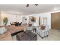 Open-concept living room with ample seating, a dining area, and a view of the kitchen, ideal for entertaining at 955 E Knox Rd # 137, Chandler, AZ 85225