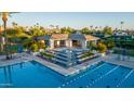 Upscale community pool area showcasing a tiered water feature and a shaded lounge area at 11993 E Mission Ln, Scottsdale, AZ 85259