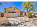 Inviting single-story home featuring a two-car garage and covered porch entry at 12355 W Hadley St, Avondale, AZ 85323