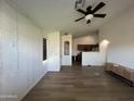 Open floor plan showcasing living room, kitchen, and ceiling fan at 12938 W Alvarado Rd, Avondale, AZ 85392