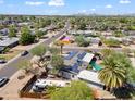 An aerial view shows this home's lush surroundings and neighborhood at 1749 W Monterosa St, Phoenix, AZ 85015