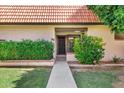 Inviting front entrance with well-manicured bushes and a walkway leading to a dark-colored front door at 195 N Cottonwood St # 26, Chandler, AZ 85225