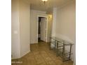 Hallway with tile floors and a glass console table at 20221 N 31St St, Phoenix, AZ 85050