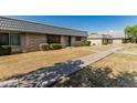 Exterior view showcasing the community's well-maintained lawns and walkways at 2041 W Pierson St, Phoenix, AZ 85015