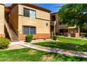 Charming apartment complex exterior featuring lush landscaping, well-kept lawn, and inviting walkways at 2134 E Broadway Rd # 1062, Tempe, AZ 85282