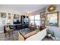Comfortable living room showcasing eclectic decor, a stylish sofa, and bright natural light at 2201 N Central Ave # 3C, Phoenix, AZ 85004
