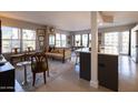 Bright and airy living room featuring a sofa, dining area, and large windows with city views at 2201 N Central Ave # 3C, Phoenix, AZ 85004