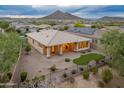 A covered patio and artificial turf create a low-maintenance backyard retreat at 31207 N 124Th Dr, Peoria, AZ 85383