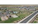 This photo highlights the community amenities: a park with a pool, playground, and basketball court at 3885 E Kenley Ln, San Tan Valley, AZ 85143