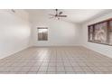 Bright living room features tile flooring, vaulted ceilings, and ample natural light at 4110 W Villa Linda Dr, Glendale, AZ 85310