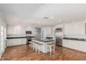 Spacious kitchen featuring stainless steel appliances, granite countertops and large center island with seating at 5118 E Mulberry Dr, Phoenix, AZ 85018