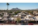 Expansive aerial view showcasing the community, with a mountain range in the backdrop at 5637 N 78Th Way, Scottsdale, AZ 85250