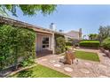 Serene backyard with lush greenery and a charming fountain feature at 9636 N 53Rd Ave, Glendale, AZ 85302