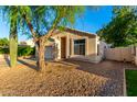 Inviting single-story home with desert landscaping, a two-car garage and a well-maintained yard at 10735 W Bermuda Dr, Avondale, AZ 85392