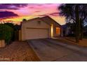 Lovely single-story home featuring a two-car garage and low-maintenance desert landscaping at 10735 W Bermuda Dr, Avondale, AZ 85392