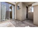 Outdoor patio showcasing sliding glass doors and a private entrance at 1225 N 36Th St # 1015, Phoenix, AZ 85008