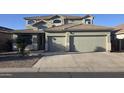 Inviting two-story home featuring a two-car garage and a well-maintained front yard at 18174 E Via Jardin --, Gold Canyon, AZ 85118