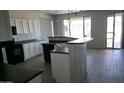 Well-equipped kitchen boasts a breakfast bar, ample counter space, and backyard access at 18174 E Via Jardin --, Gold Canyon, AZ 85118